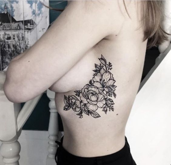 Flower tattoo on the chest for women