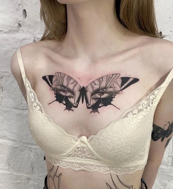 Butterfly tattoo on the chest for women