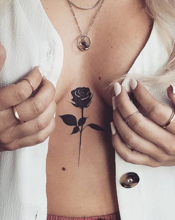 Rose tattoo on the chest for women