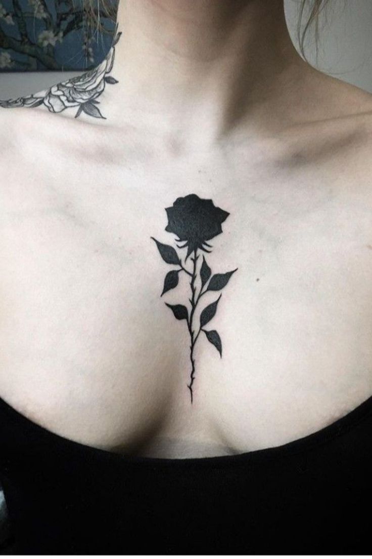 Rose tattoo on the chest for women