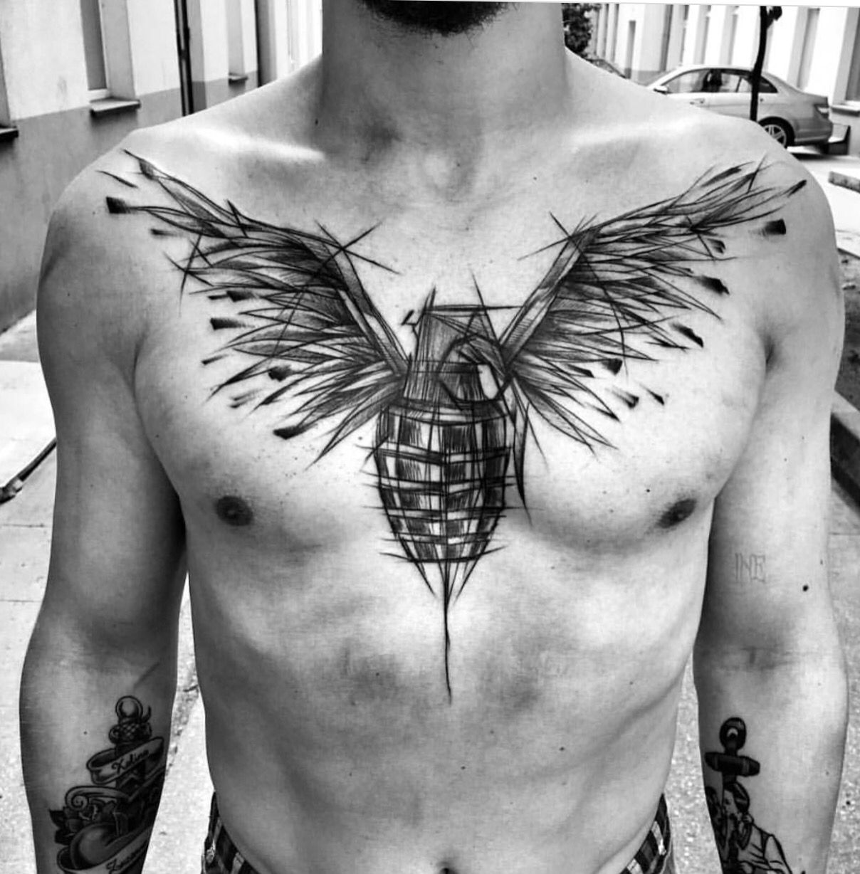 Tattoo of a pomegranate on the chest for men