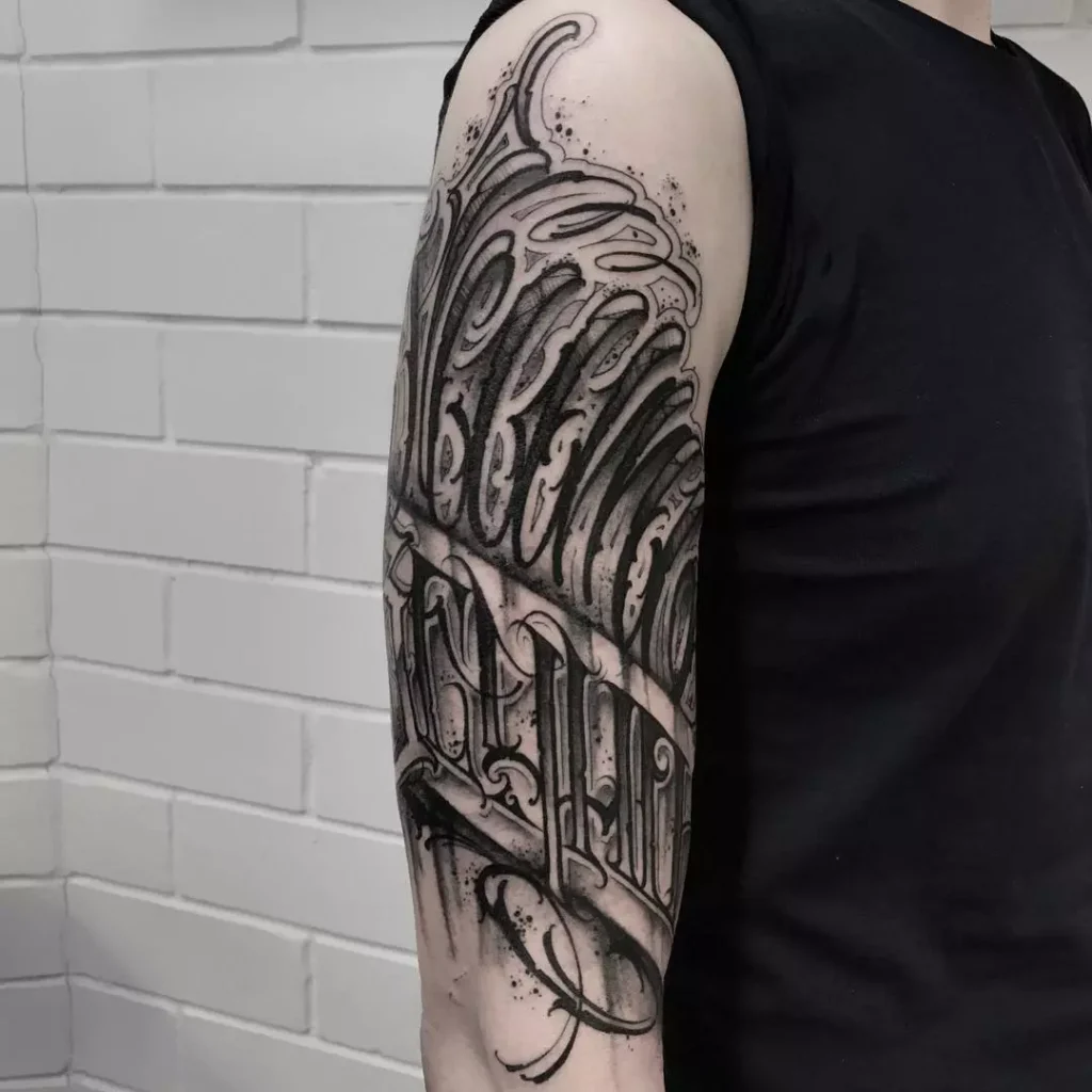 Calligraphy tattoo on the shoulder for men