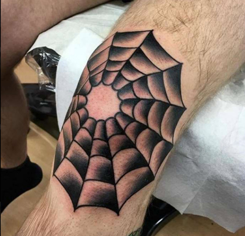 Spider web tattoo on the knee for men