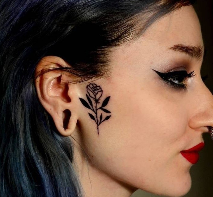 Rose tattoo on the face for women