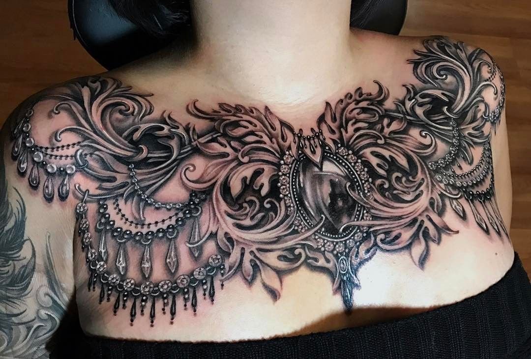 Baroque tattoo on the chest for women