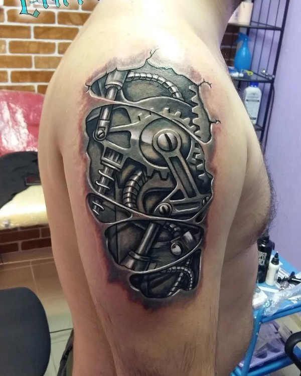 Biomechanics style tattoo on the shoulder for men