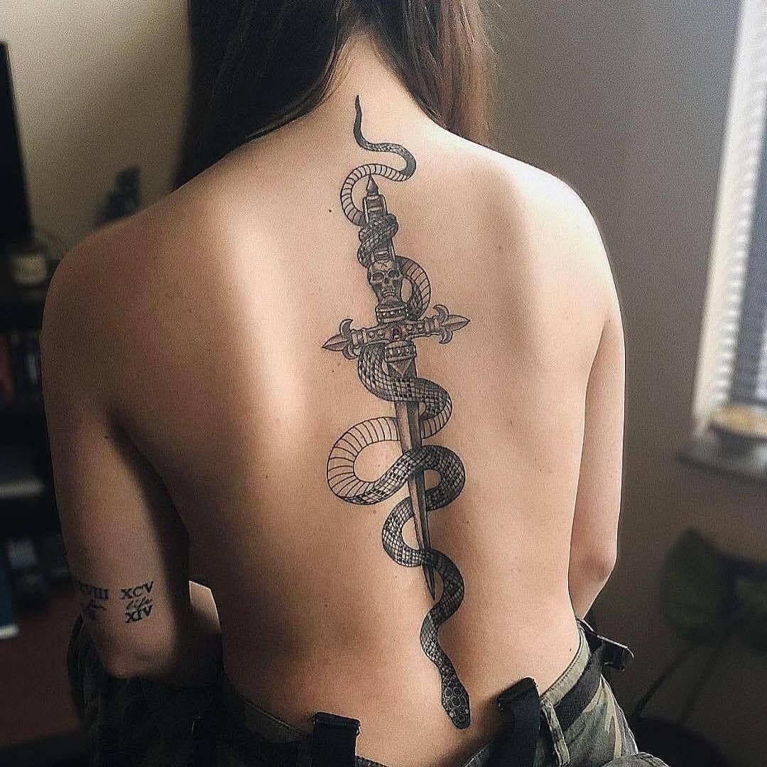 Large snake and sword tattoo on the spine for women