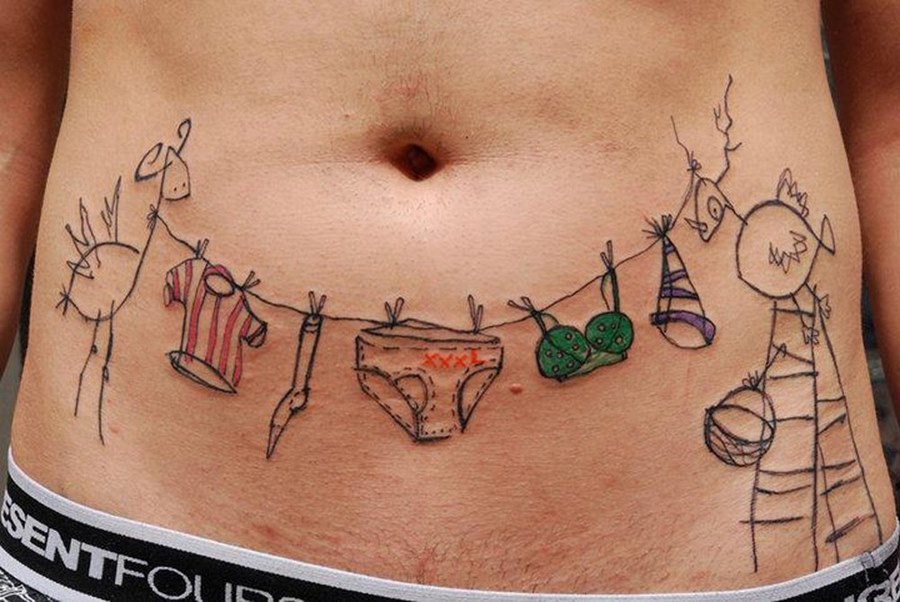 Art brut tattoo on the stomach for men