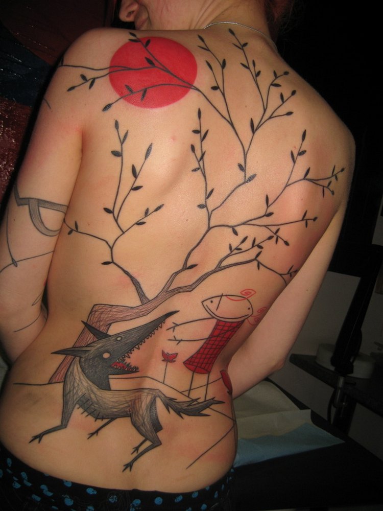 Art brut tattoo on the back for women