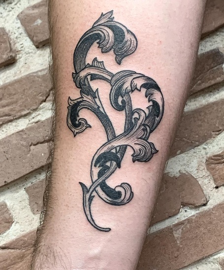 Baroque tattoo on the forearm for men