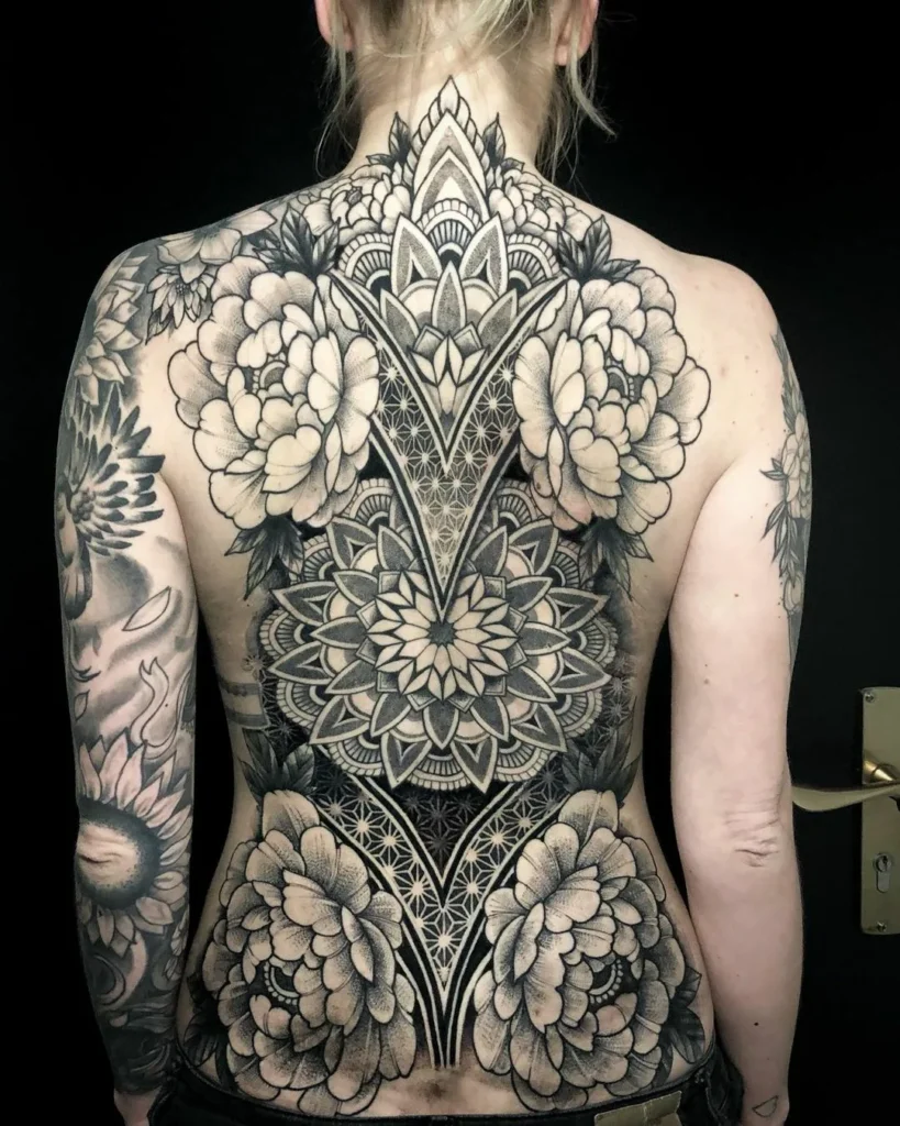 Blackwork tattoo on the back for women