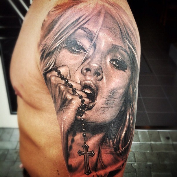 Large tattoo of a girl on the shoulder for women