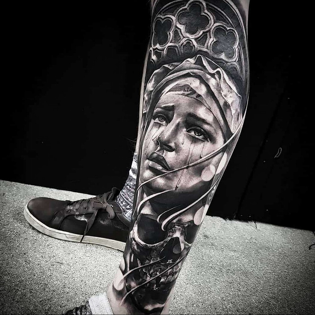 Large black&grey style tattoo on the arm for a leg for men