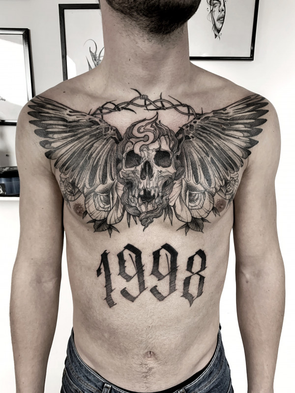 Skull tattoo on the chest for men