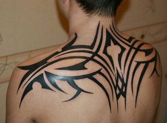 Tribal style tattoo on the back for men