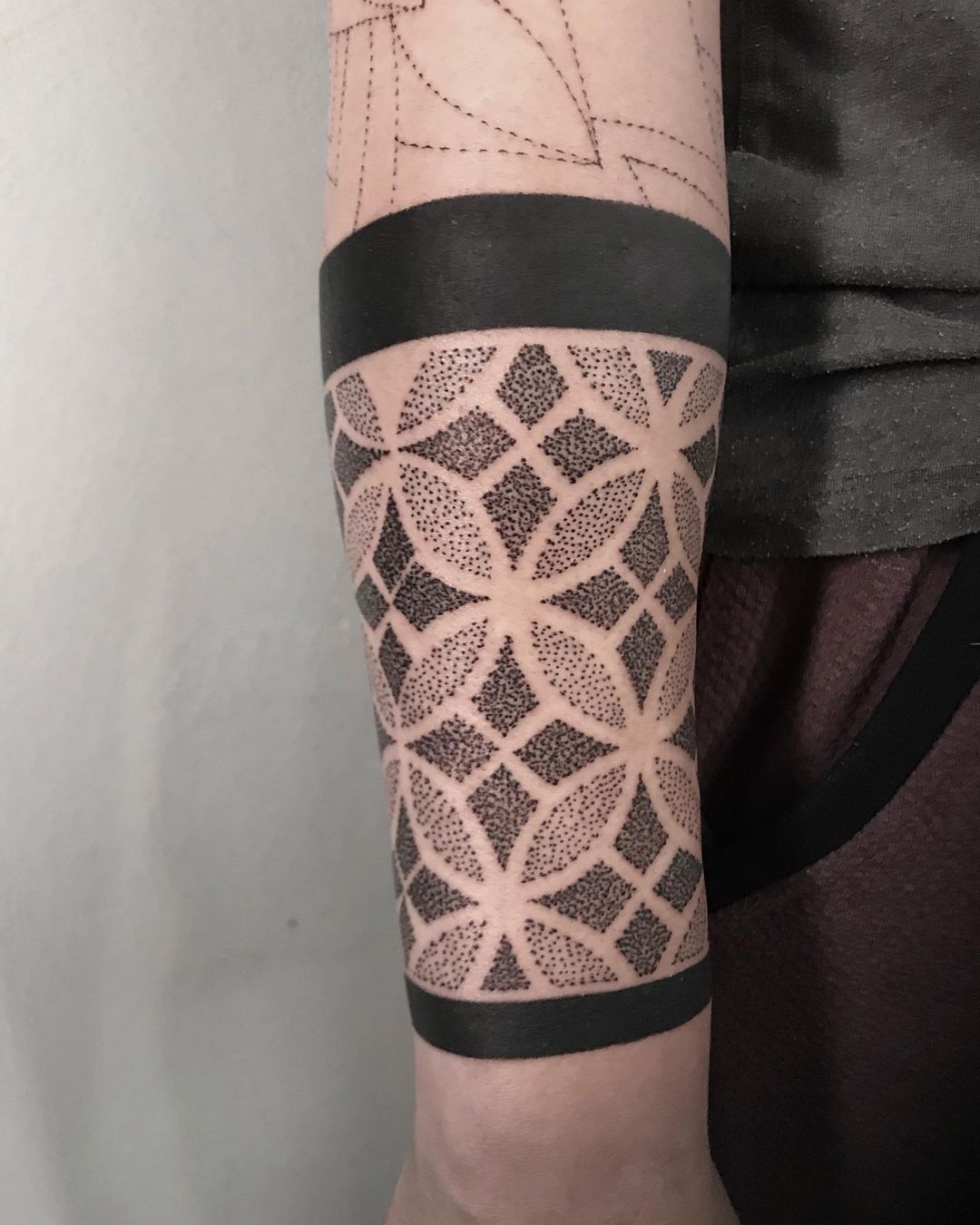 Ornamental style tattoo on the forearm for men