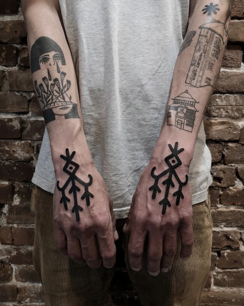 Ornamental style tattoo on the hand for men