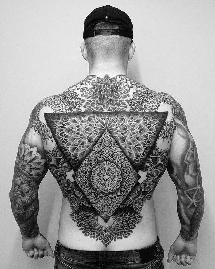 Ornamental style tattoo on the back for men