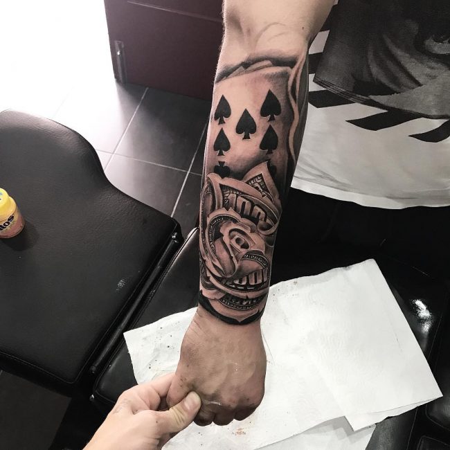 Money tattoo on arm for men