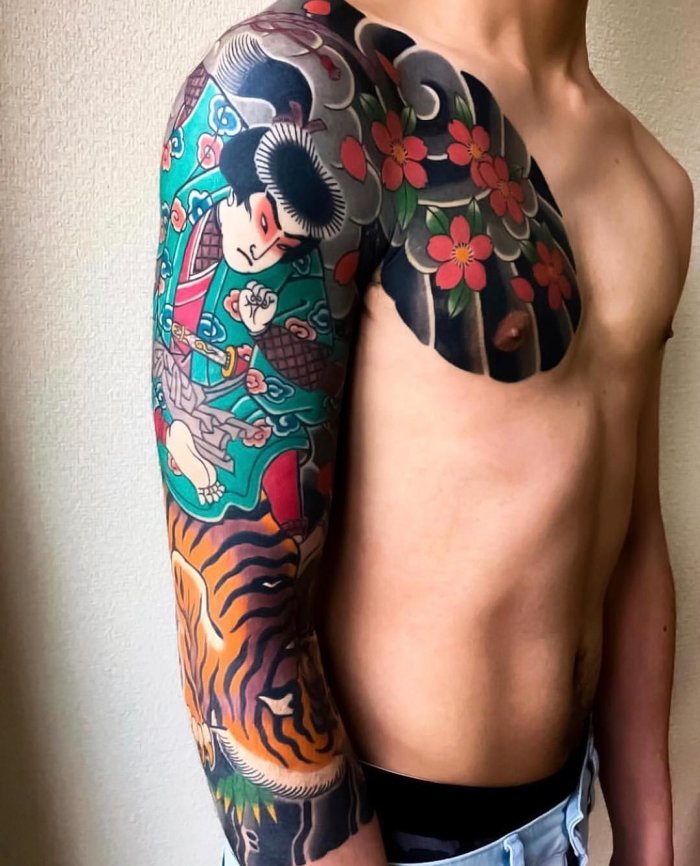 Japan style color tattoo on the arm for men