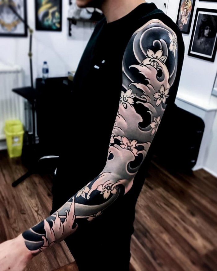 Large Japan style tattoo on the arm for men