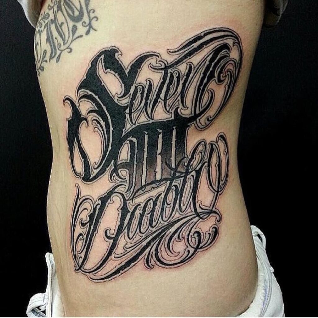 Lettering style tattoos on the side for women