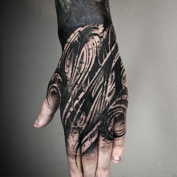 Lettering style tattoos on the hands for men