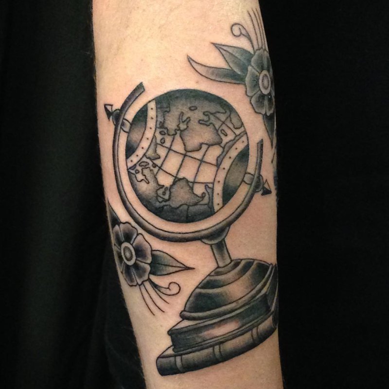 Globe tattoo on arm for men