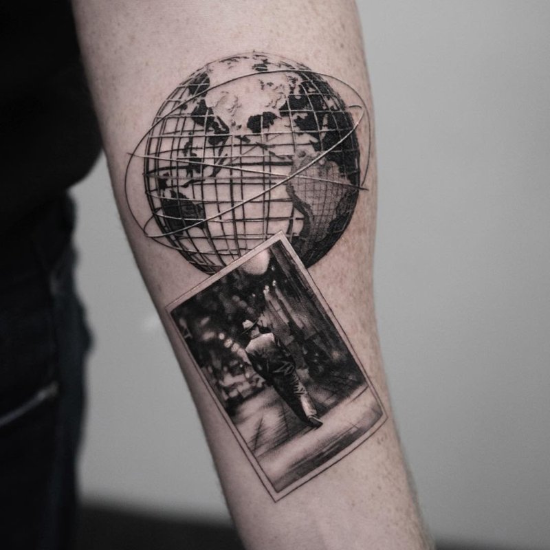 Globe tattoo on forearm for men