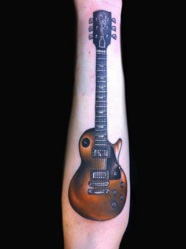 Guitar tattoo on the arm for men