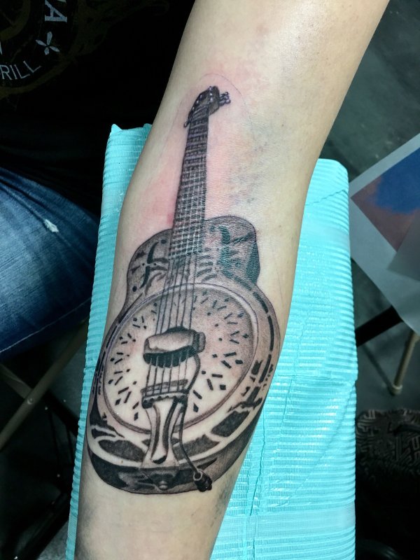 Guitar tattoo on forearm for men