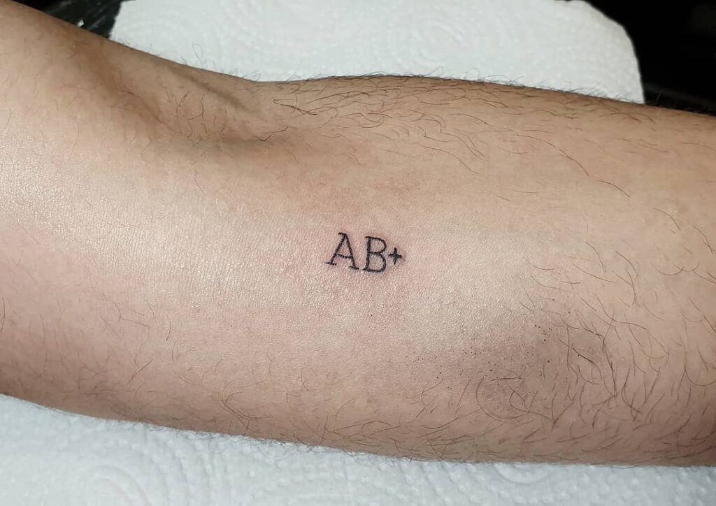 Blood type tattoo on the calf for men