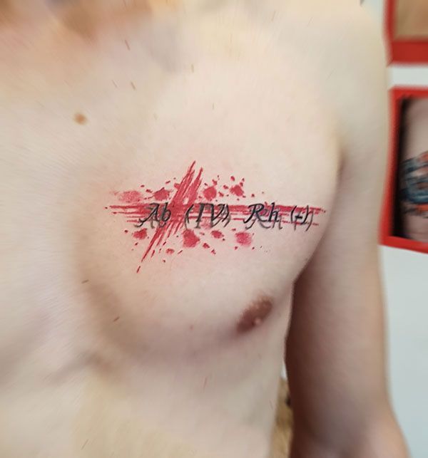 Blood type tattoo on chest for men