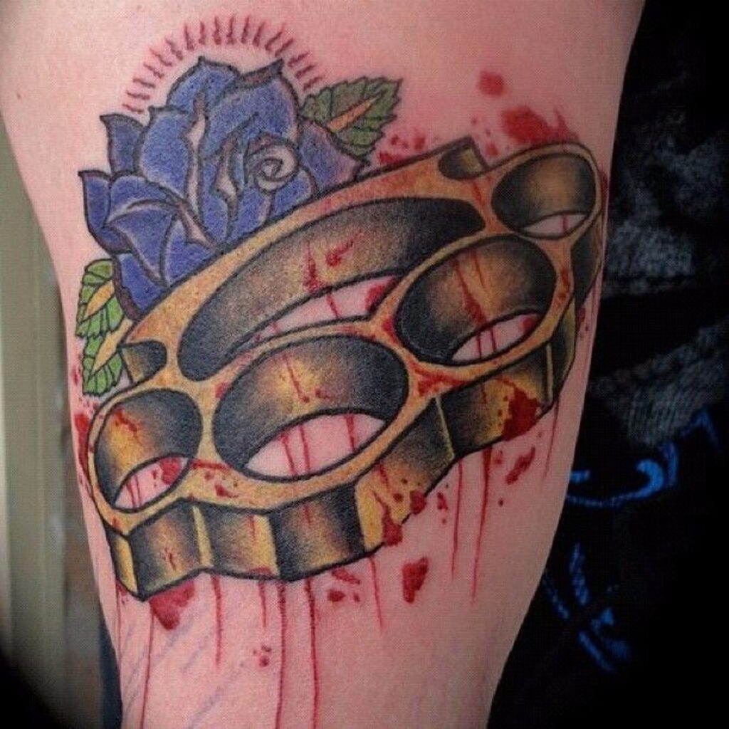 Knuckles tattoo on the thigh for women