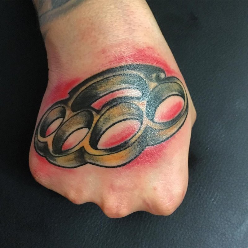 Knuckles tattoo on the arm for men