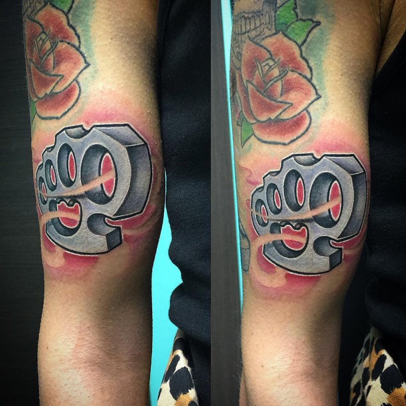 Knuckles tattoo on the arm for men