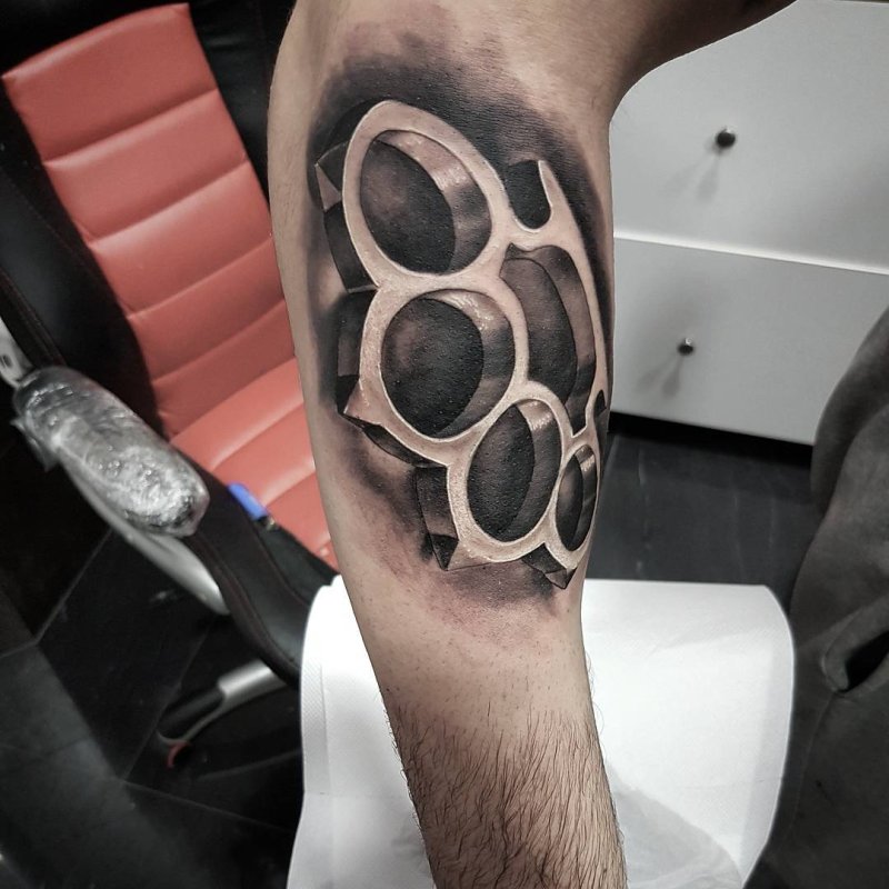 Knuckles tattoo on the arm for men