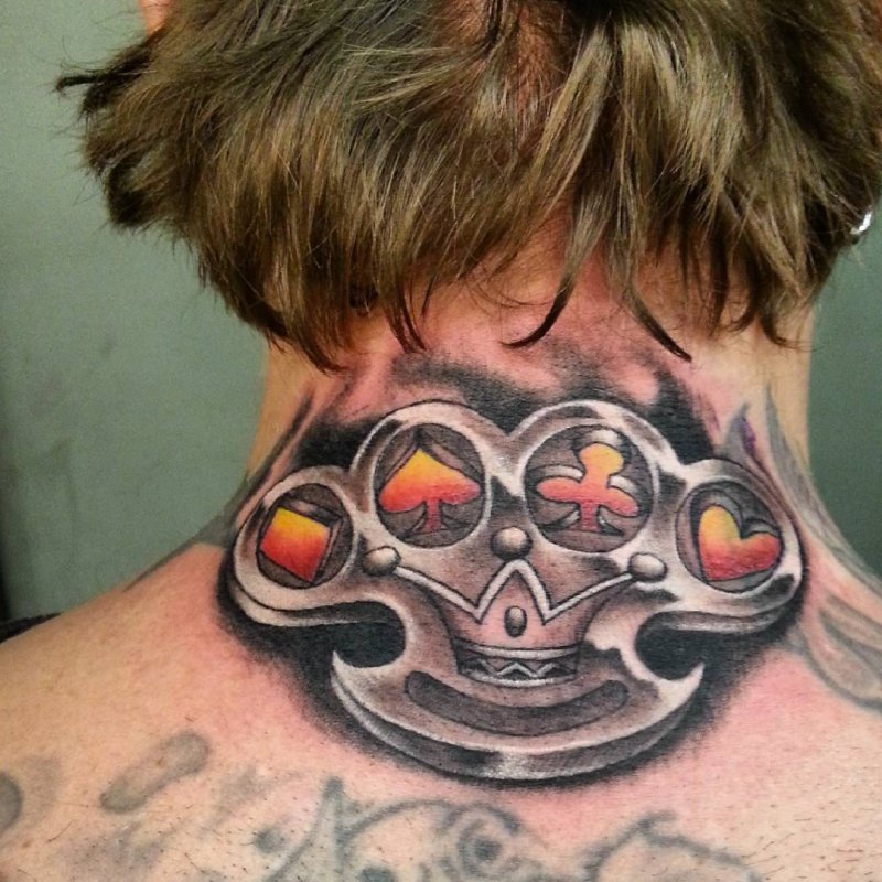 Knuckles tattoo on the back of the head for men