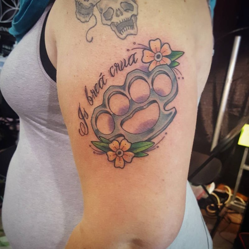 Knuckles tattoo on the shoulder for women