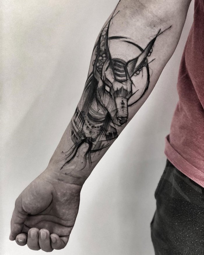 Anubis tattoo on forearm for men