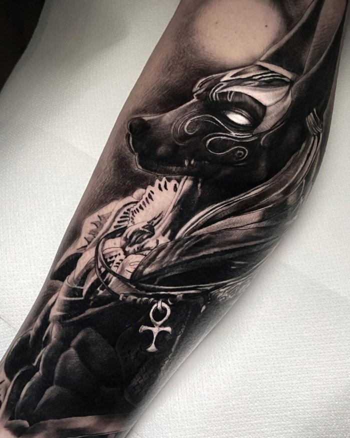 Anubis tattoo on forearm for men