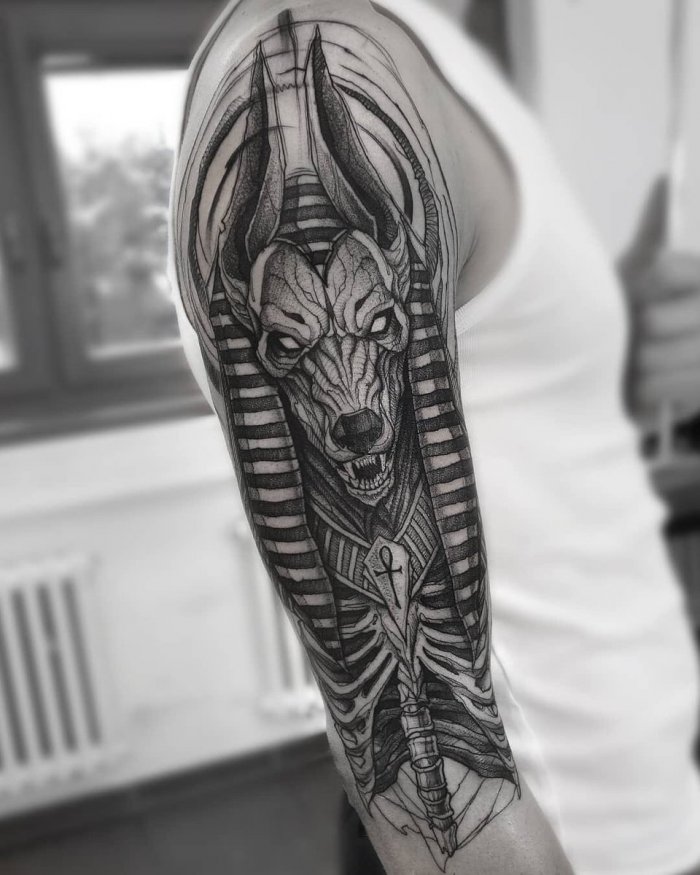 Large Anubis tattoo on the arm for men