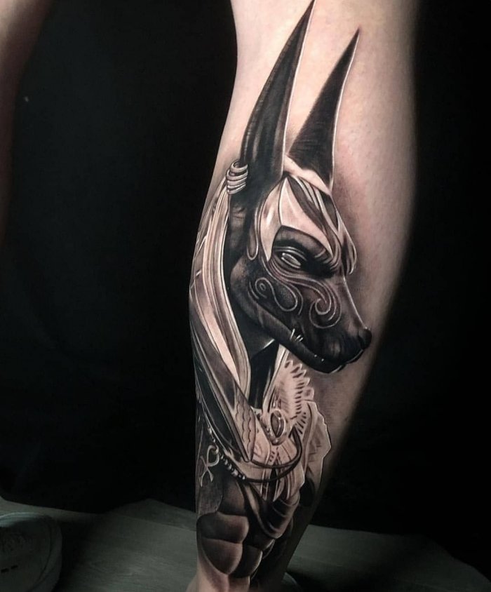 Anubis tattoo on the leg for men