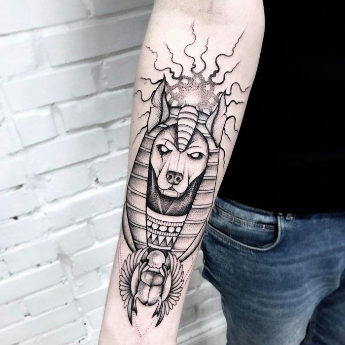 Anubis tattoo on forearm for men