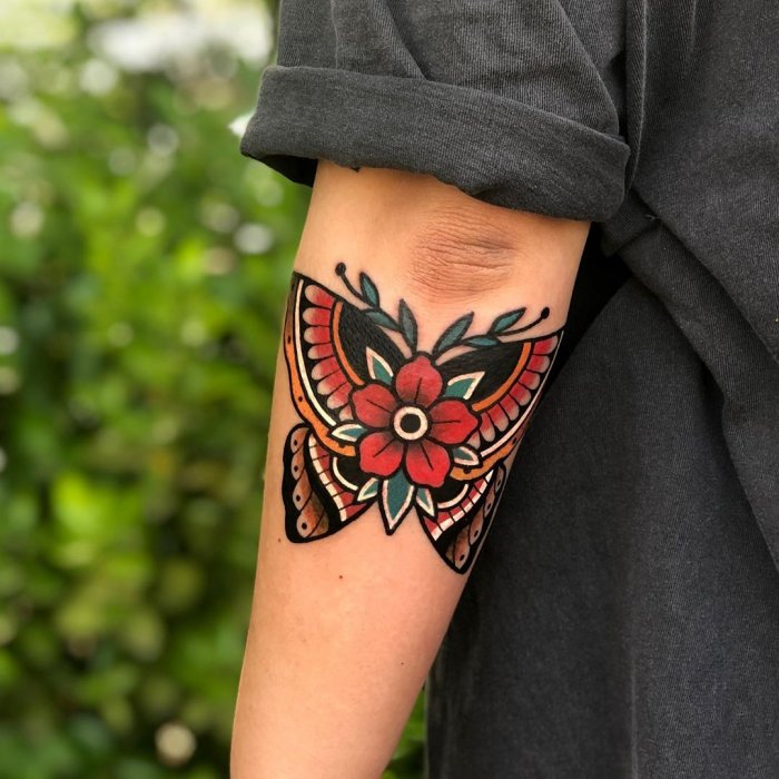 Old skool style butterfly tattoo on the forearm for men