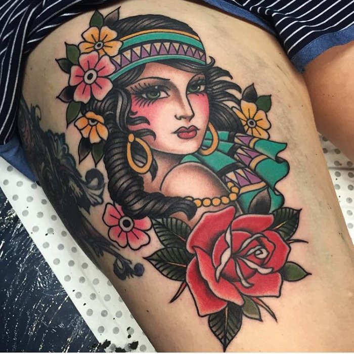 Large old skool style tattoo on the hip for women