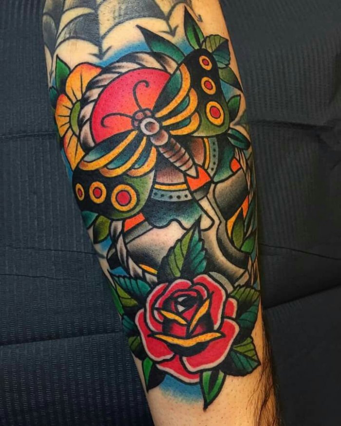 Colored old skool tattoo on the arm for men