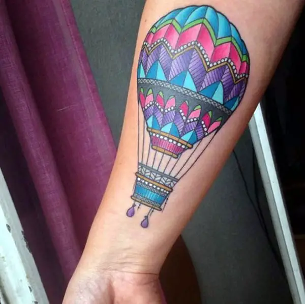 Colorful balloon tattoo on forearm for women