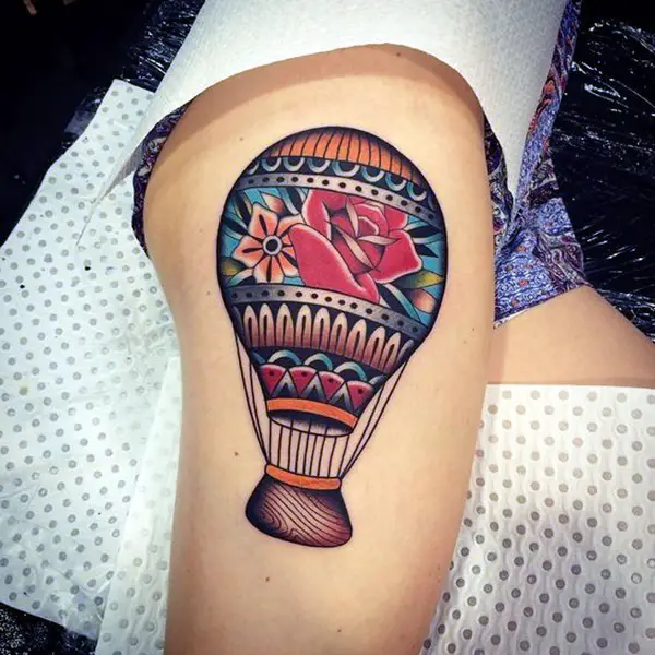 Balloon tattoo on thigh for women