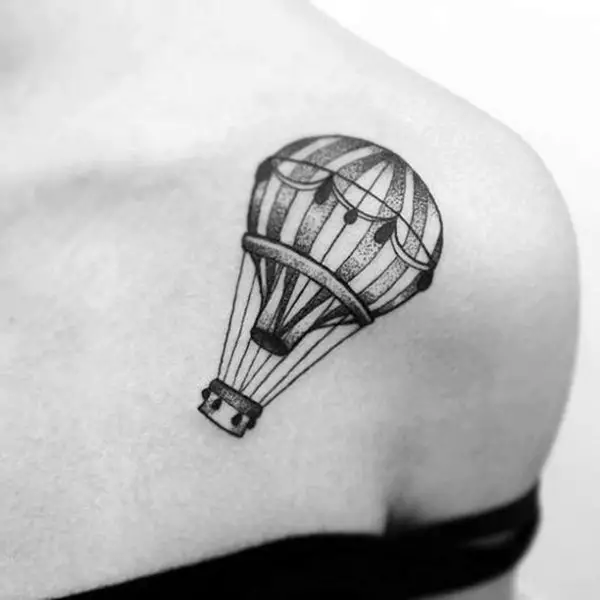 Balloon tattoo on collarbone for women